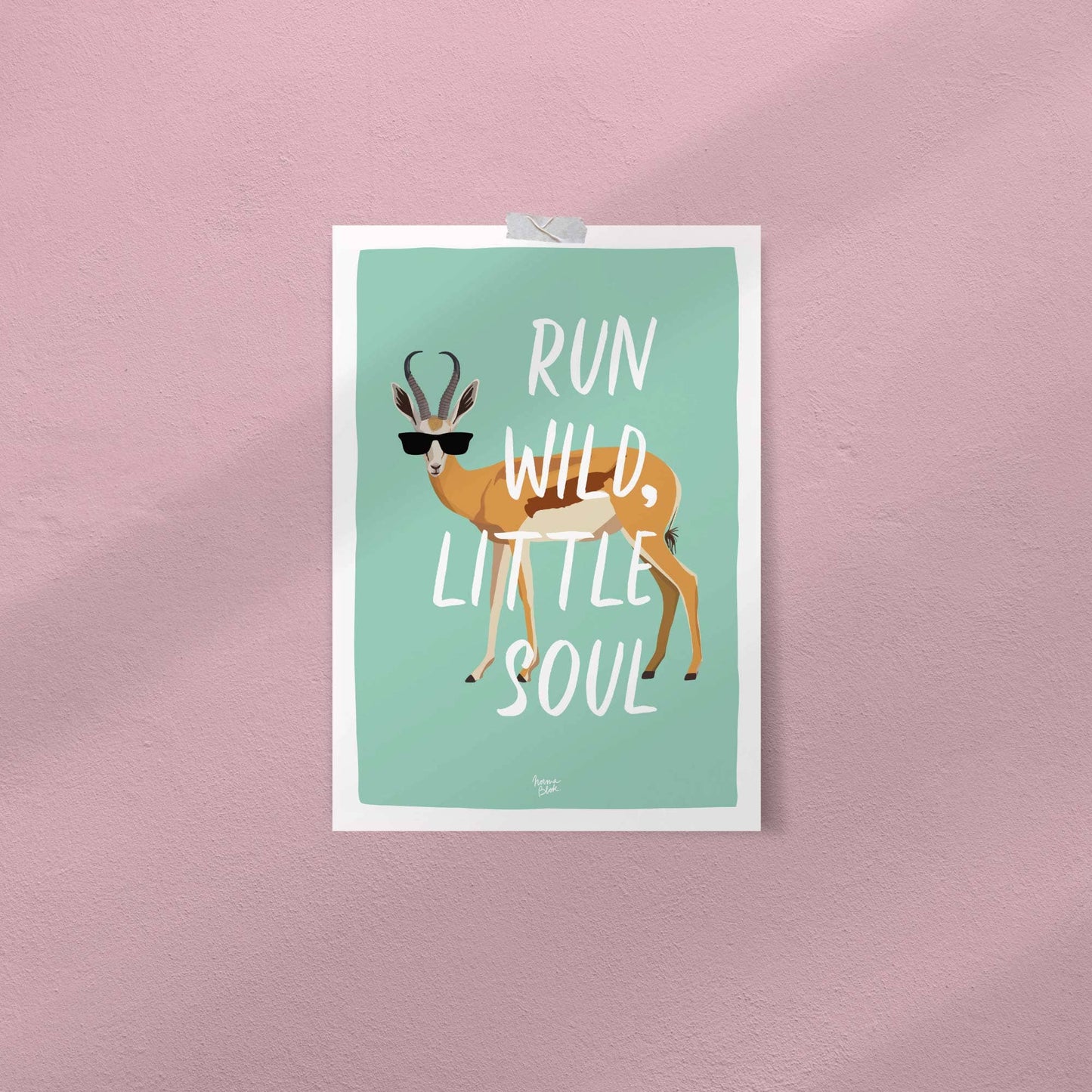 The funny digital antelope illustration with sunglasses attached directly to a clean white playroom wall using colorful pieces of washi tape. This shot demonstrates an easy, casual, and frames-free way to style the art print in a modern home setup.