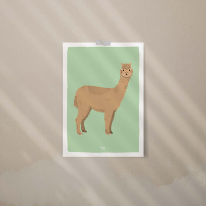 An alpaca art print attached to a beige wall using colorful decorative washi tape. This casual, trendy display is perfect for a relaxed office or bedroom, offering a creative, frame-free way to style your space with modern wall art.