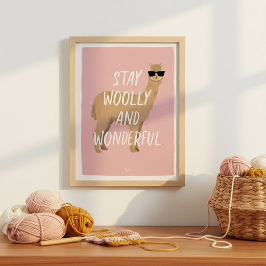 The alpaca art print in a modern frame, styled inside a creative craft room. It sits on a shelf surrounded by colorful yarn balls, knitting needles, and textile tools, showing how this humorous print adds personality and a modern touch to a dedicated sewing space.