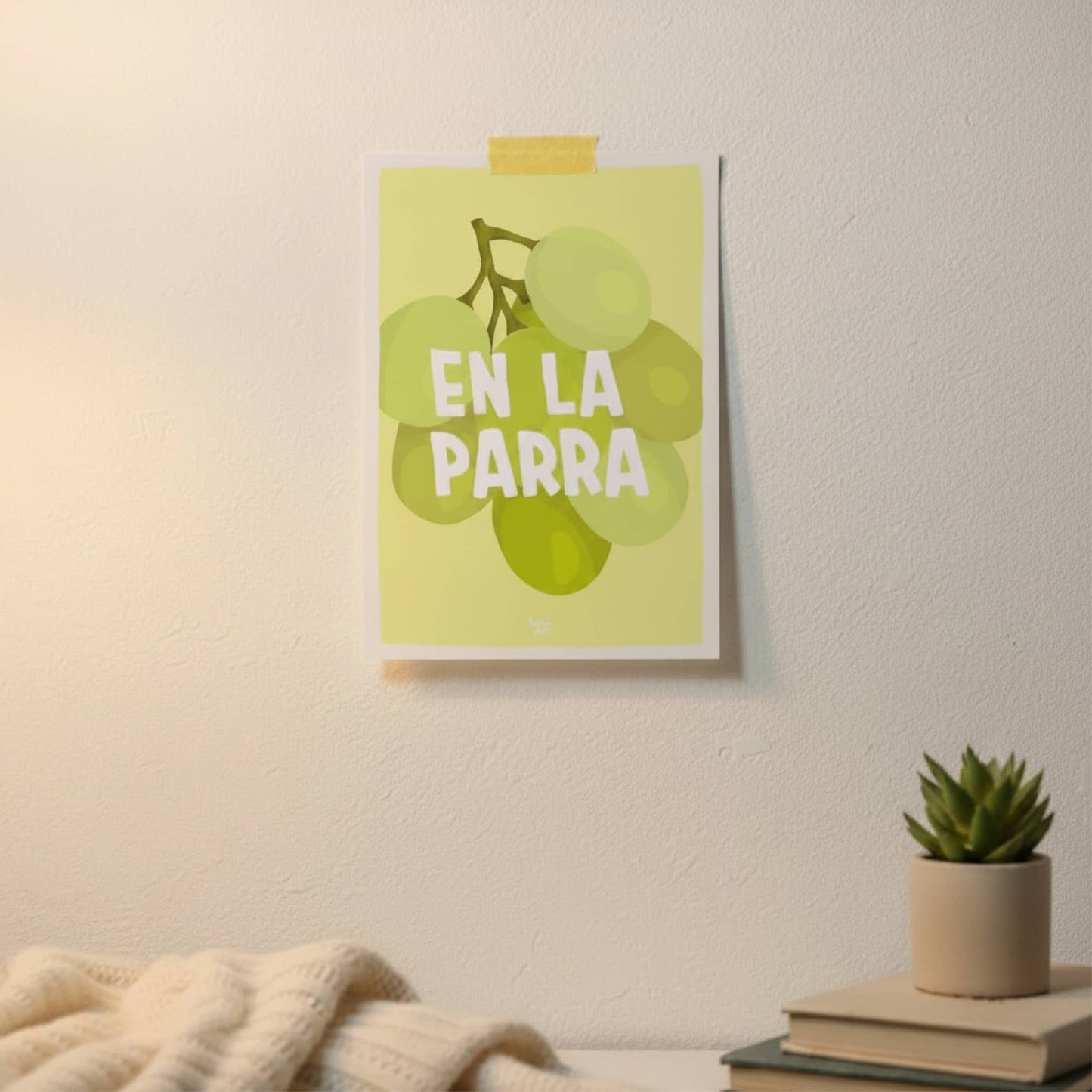 The "en la parra" postcard pinned to a mood board in a home office, illustrating how it serves as a fun and decorative mental health reminder by normablok.