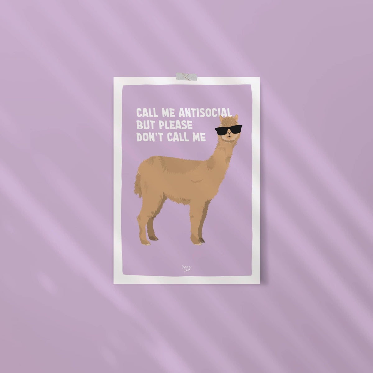 An ISO-proportion alpaca print stuck to a vibrant violet wall with washi tape by Normablok.