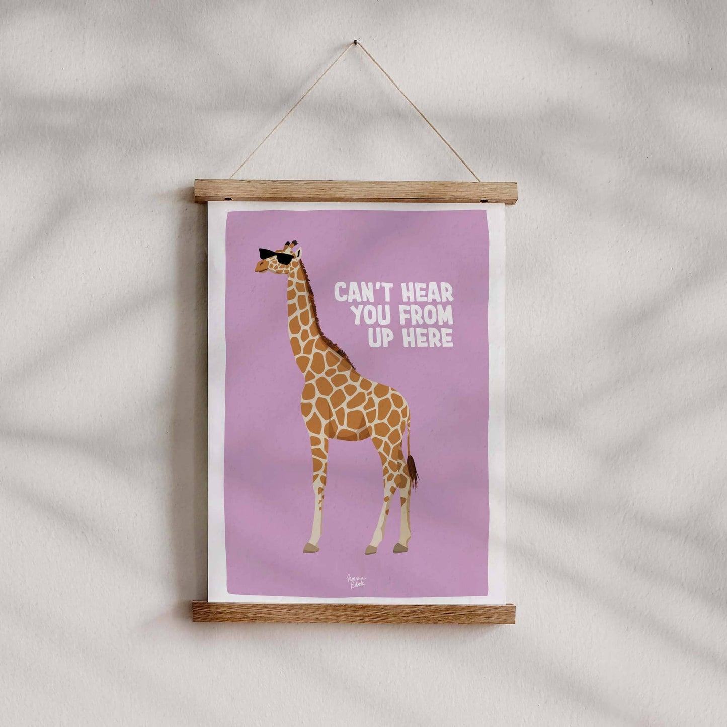 The lilac giraffe art print hanging stylishly on a wall using a modern magnetic wooden poster hanger with bars at the top and bottom. This minimalist setup highlights the clean layout of the print and offers a contemporary, lightweight alternative to traditional framing.