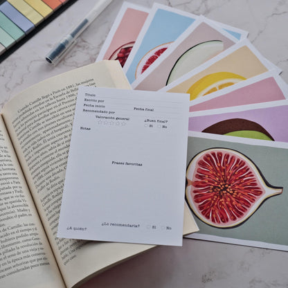 Close up of the back of a fruit reading log card showing a clean template to fill in book titles, ratings, and favorite quotes by Normablok.