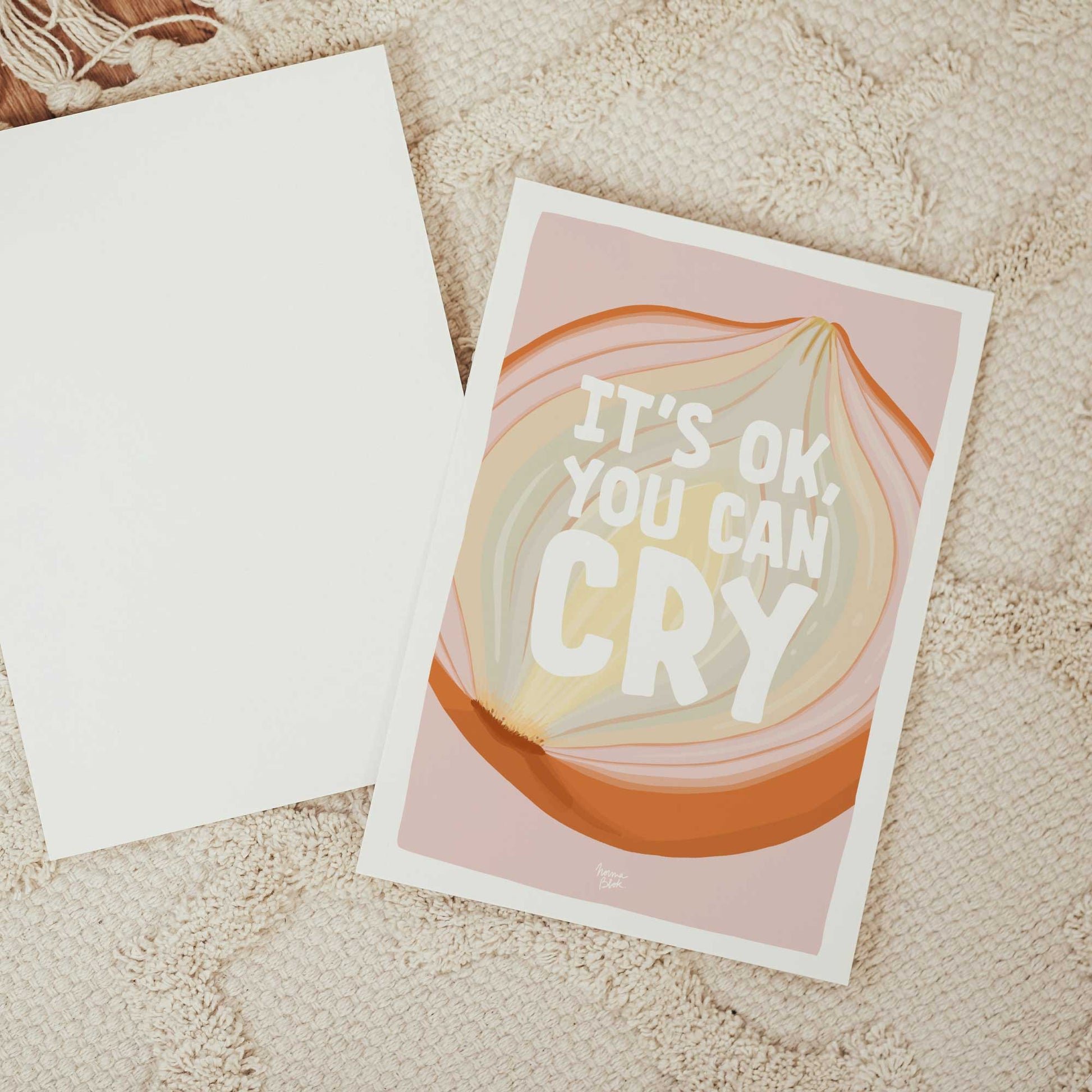 Close up of the "it's ok you can cry" mini print showing the delicate textures of the onion skins and the gentle pink background, designed with a white border by normablok.