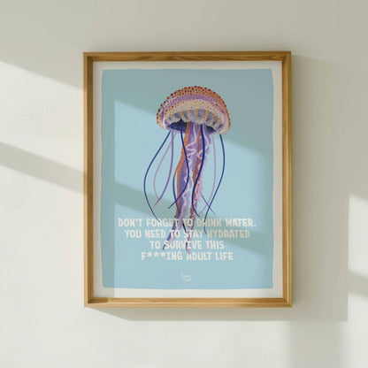 The English art print framed in light wood, hanging on a bright white wall bathed in natural sunlight from a nearby window.