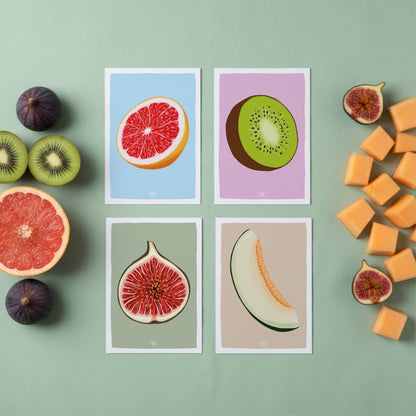 A set of four colorful fruit mini prints—fig, kiwi, melon, and grapefruit—arranged on a vibrant green surface and surrounded by fresh seasonal fruit. Each digital illustration features a soft color palette and a clean white border, designed as a visual refuge for curious minds. By normablok.