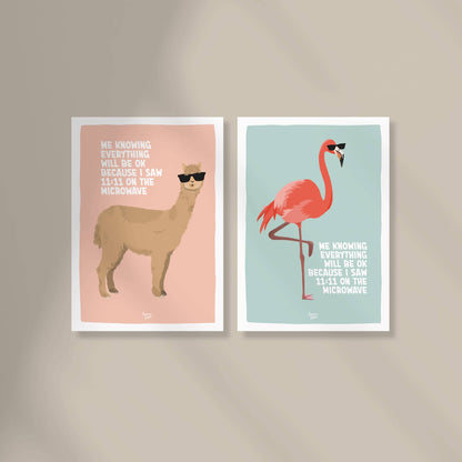 Two A6 mini prints from the "Delulu is the solulu" collection by Normablok featuring a flamingo and an alpaca with sunglasses. The text "me knowing everything will be ok because I saw 11:11 on the microwave" highlights a modern, humorous approach to spiritual signs and mental health reminders.