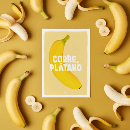 The "Corre Plátano" postcard used as decorative art in a colorful home office, showing how it adds a humorous touch to the space by Normablok.