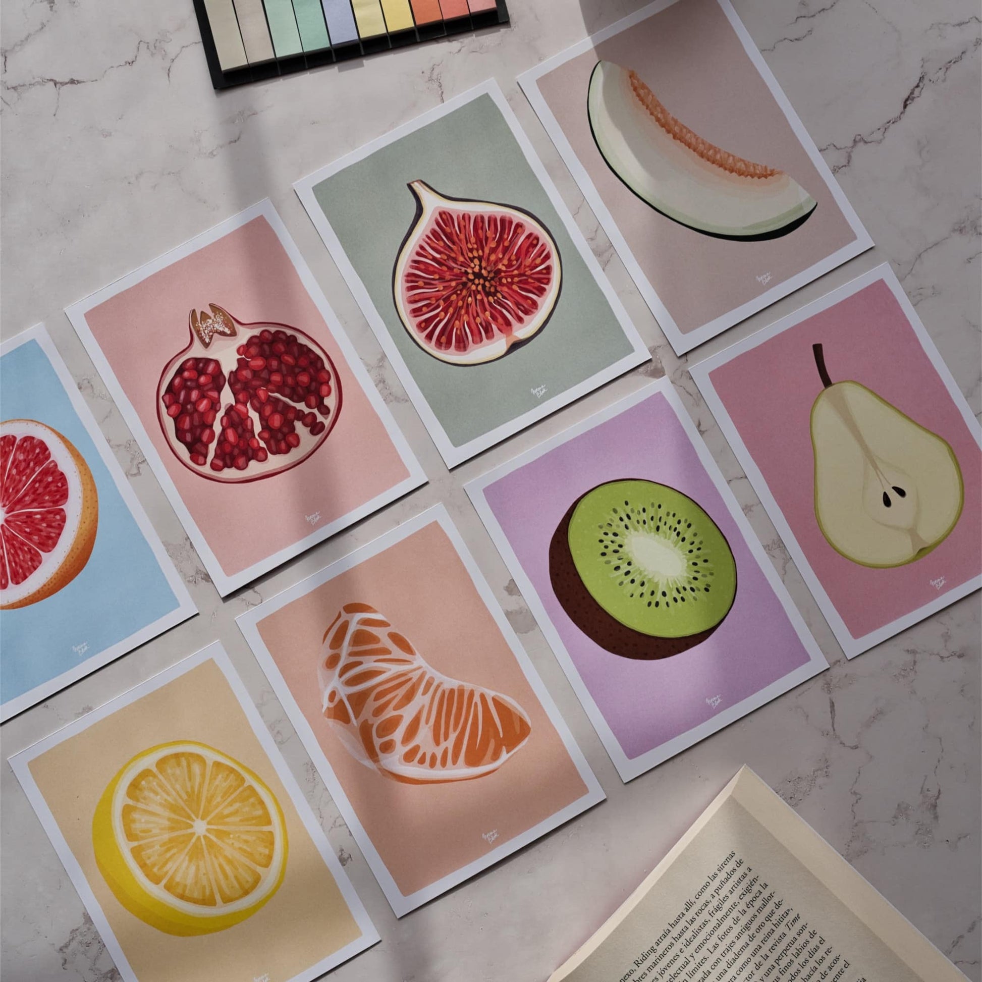 Set of 8 colorful A6 reading log cards featuring digital illustrations of fruits like pomegranate, kiwi, and lemon on a vibrant background by Normablok.