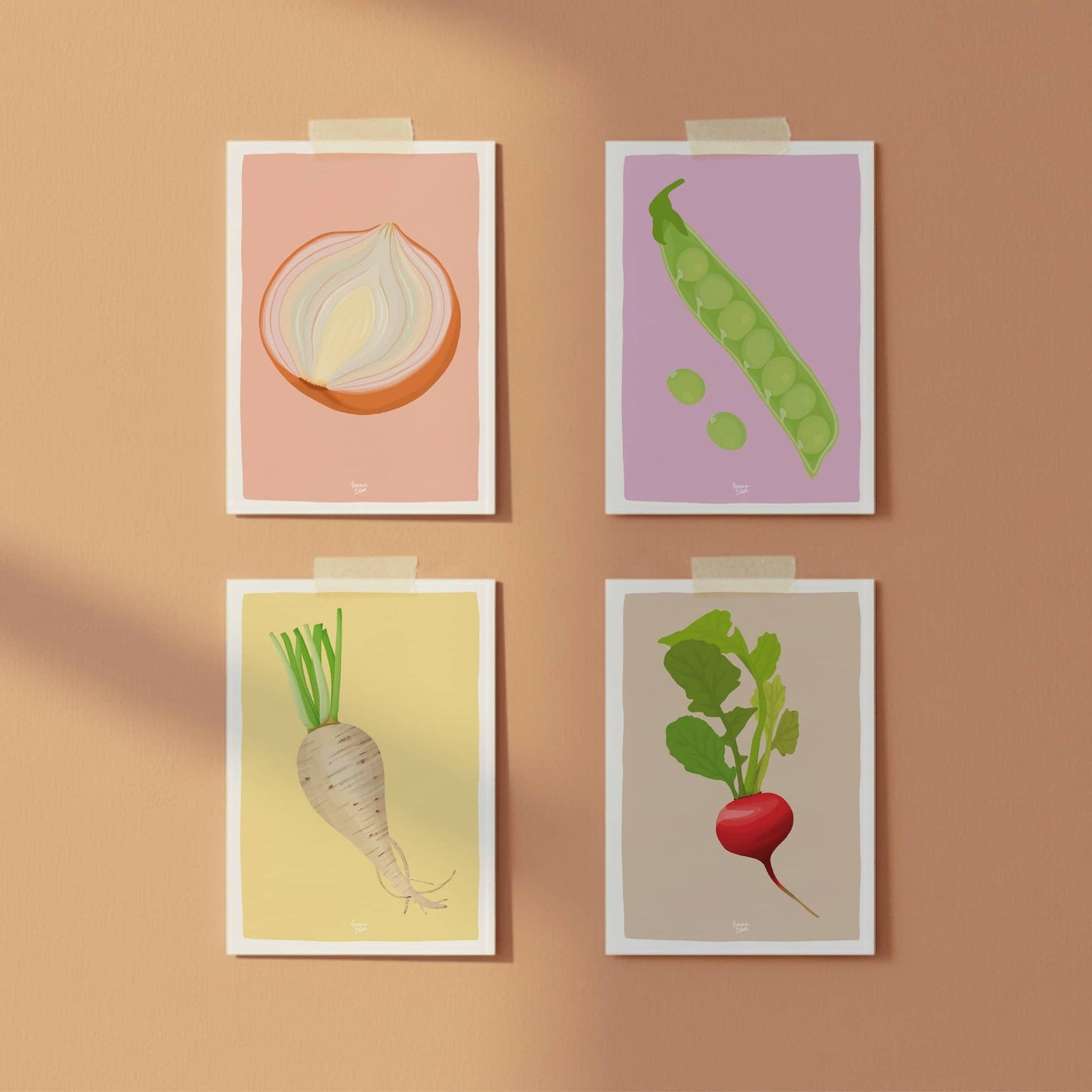 Four vegetable postcards, onion, peas, turnip, and radish, taped to a vibrant orange wall with colorful washi tape, perfect for a casual and modern gallery wall.
