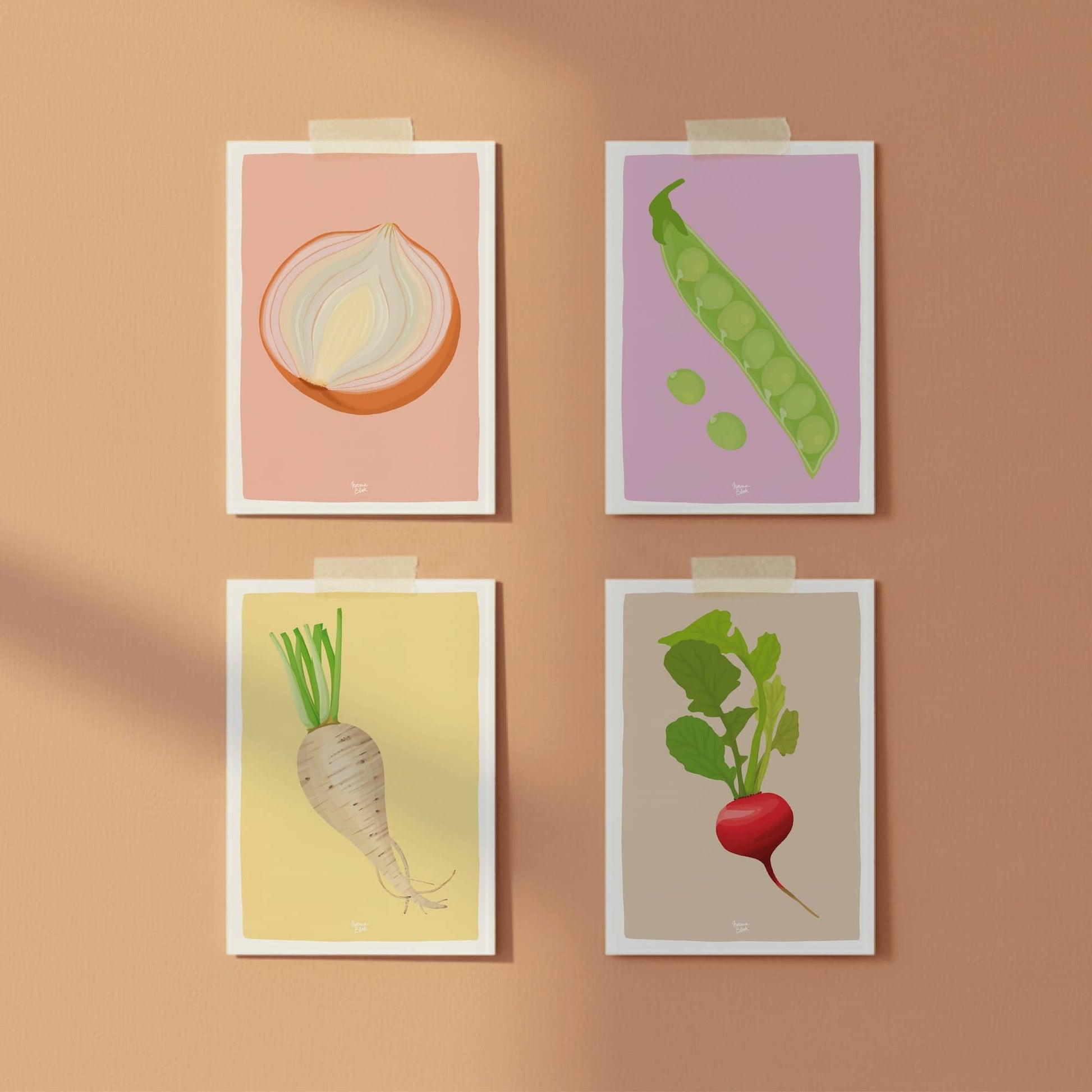 Four vegetable postcards, onion, peas, turnip, and radish, taped to a vibrant orange wall with colorful washi tape, perfect for a casual and modern gallery wall.
